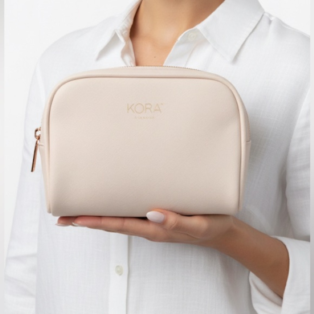Kora Organics Pink Cosmetics Bag with Rose Gold zipper detail